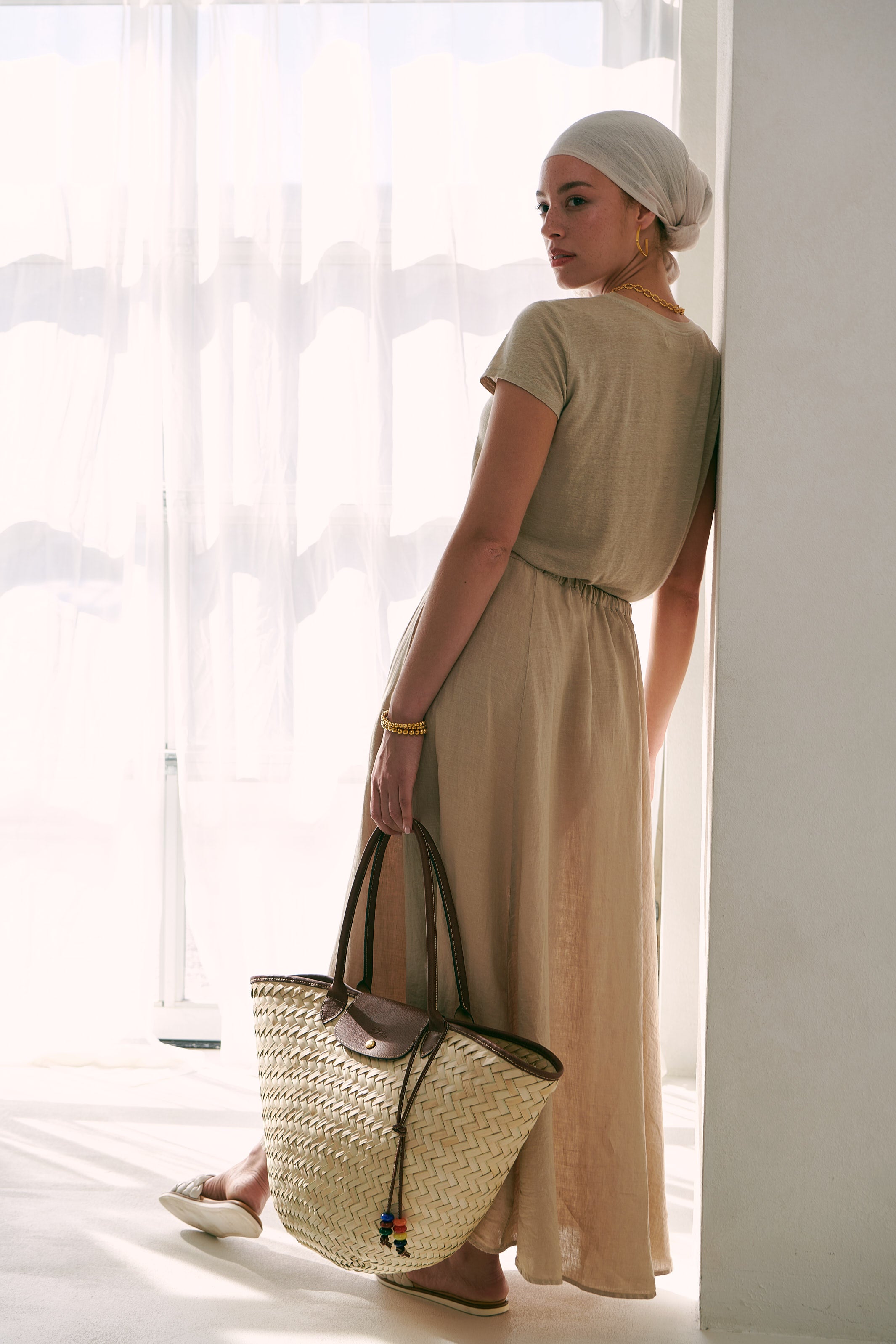 The Casey Linen Knit Crewneck Top and Bailey Woven Linen Drawstring Skirt by Velvet, paired with a longchamp woven bag