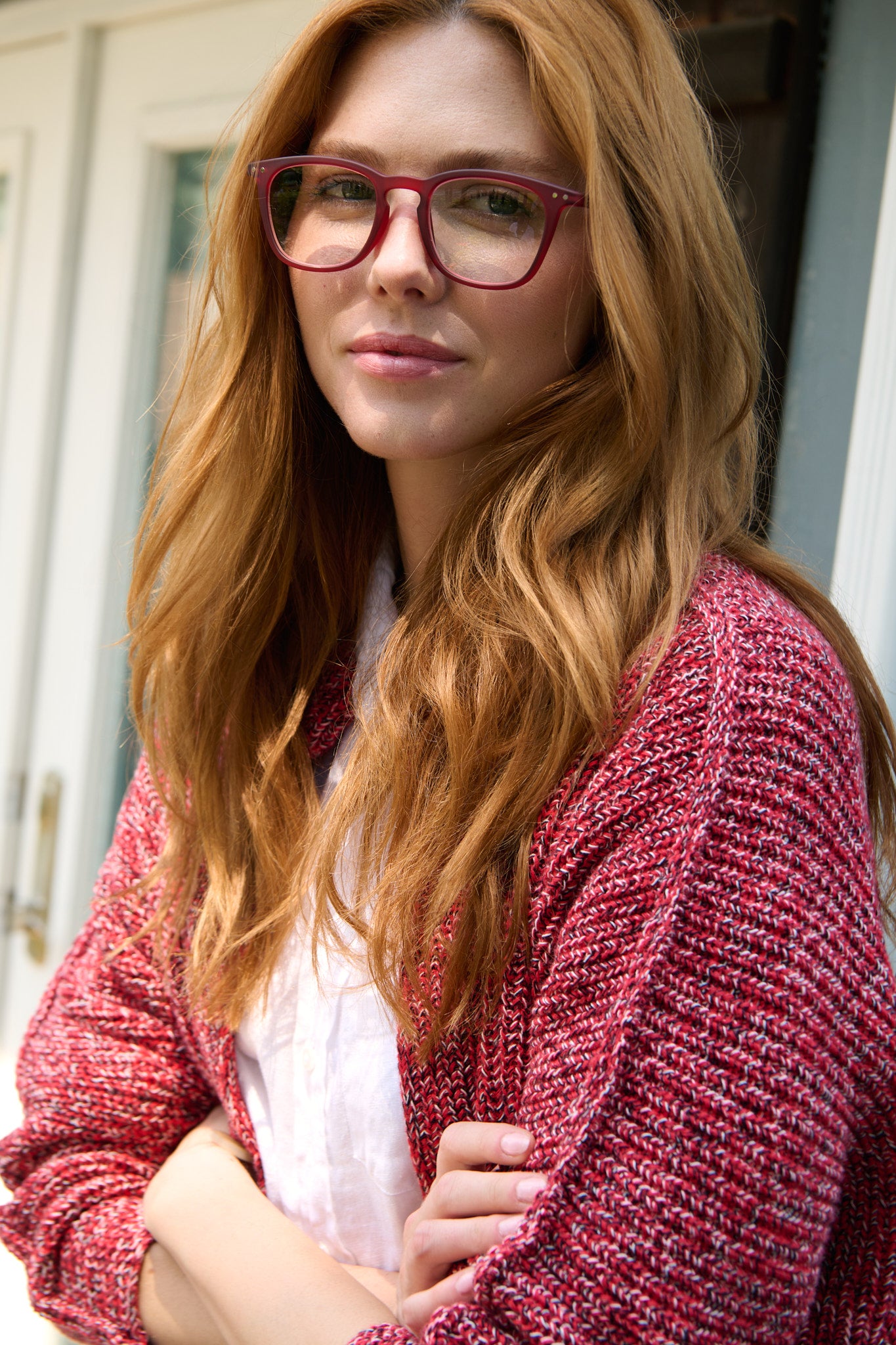 Model in a Frank & Eileen cardigan, white linen shirt and red Izipizi glasses