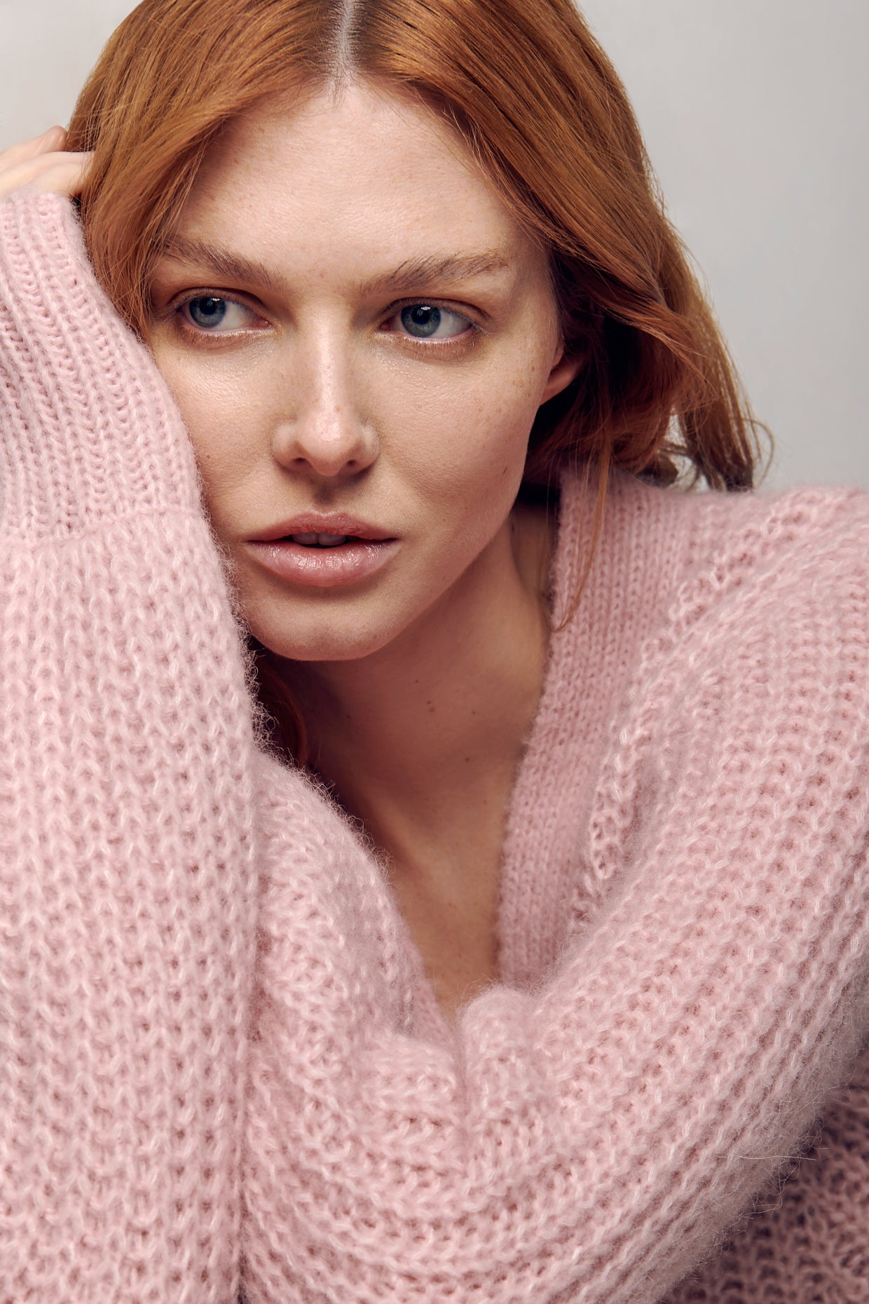 In a close-up picture, a chunky pink V-neck cardigan from Eleven Six takes center stage. The cardigan's plush texture and vibrant pink hue are showcased, adding a cozy yet stylish element to any outfit. The detailed knit pattern adds depth and dimension to the garment, while the V-neckline offers a flattering silhouette. This versatile piece is perfect for layering and adding a pop of color to any ensemble.
