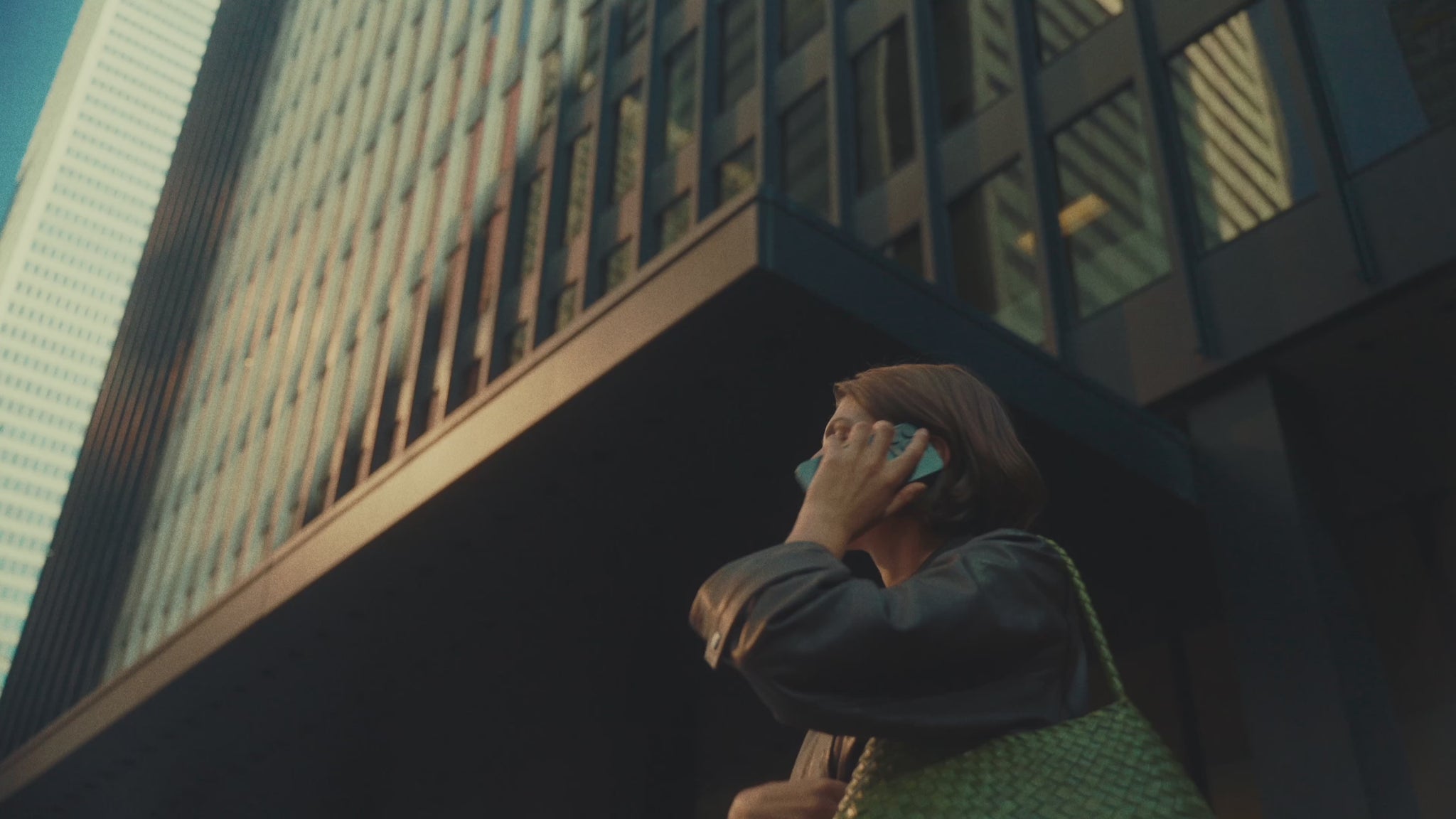 Model for Andrews Shops at First Canadian Place wears a Max Mara leather jacket and holds a bag from Dragon Diffusion