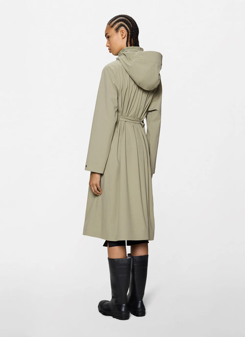 The Suva Hardshell Rain Coat in beige by Rains