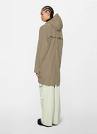 The Long Rain Jacket in beige by Rains