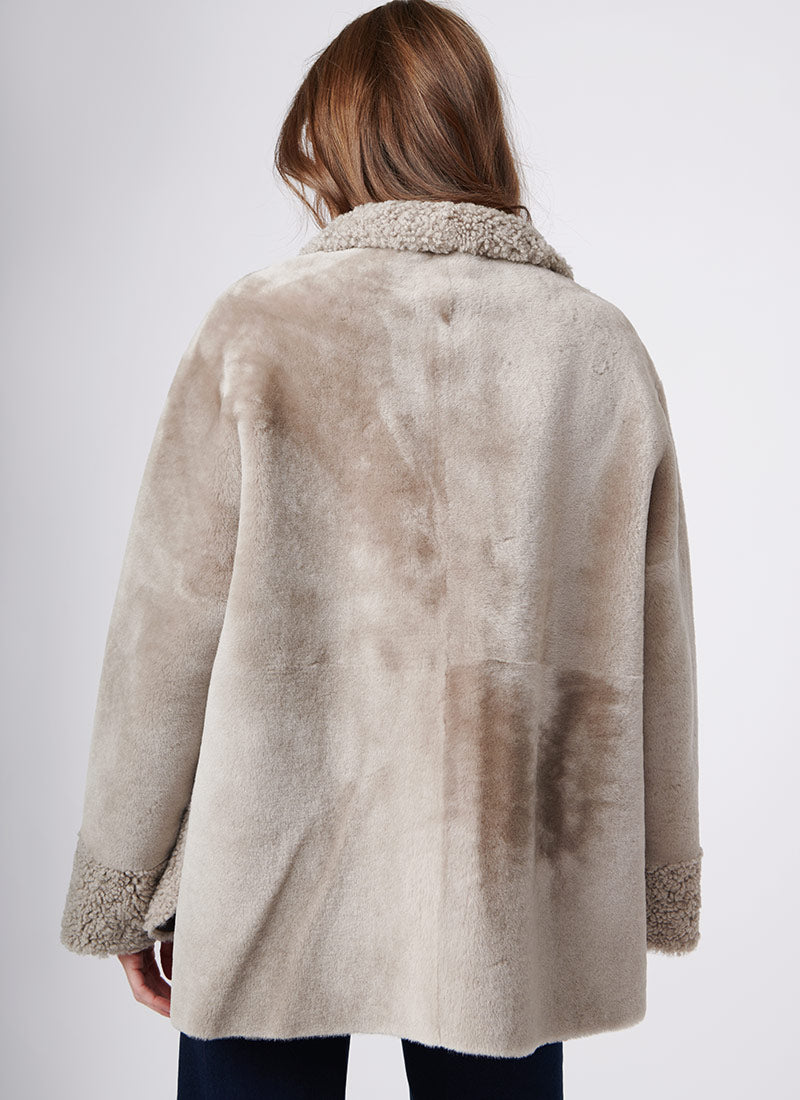 Suprema Stand Collar Textured Shearling Coat